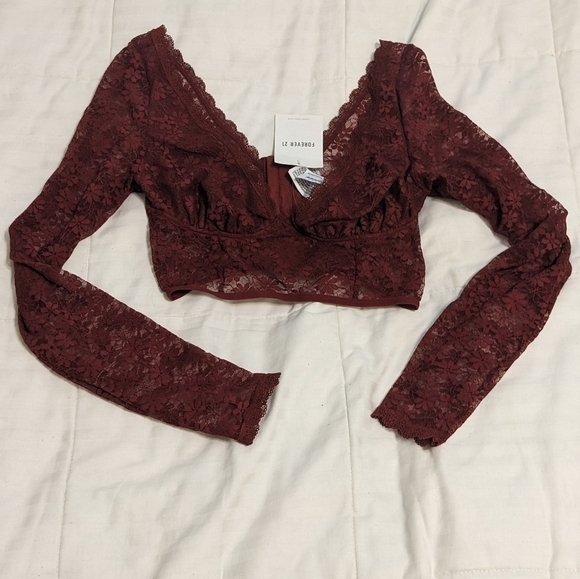 Forever 21 Tops - New with tags lacy long sleeved bustier type top size small